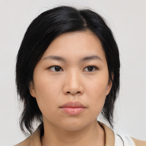Neutral asian young-adult female with medium  black hair and brown eyes