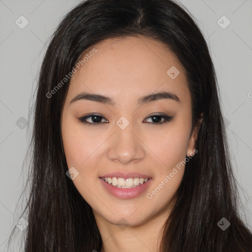 Joyful asian young-adult female with long  brown hair and brown eyes