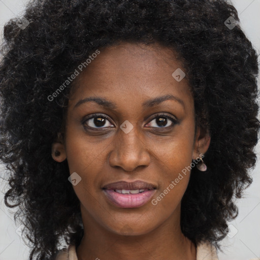 Joyful black young-adult female with long  brown hair and brown eyes