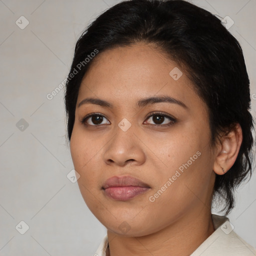 Joyful latino young-adult female with medium  black hair and brown eyes