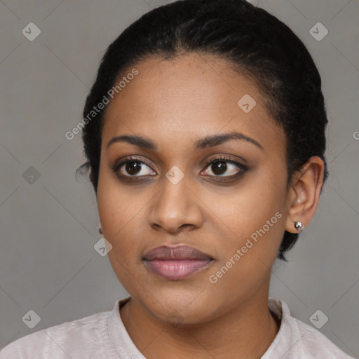 Joyful black young-adult female with short  black hair and brown eyes