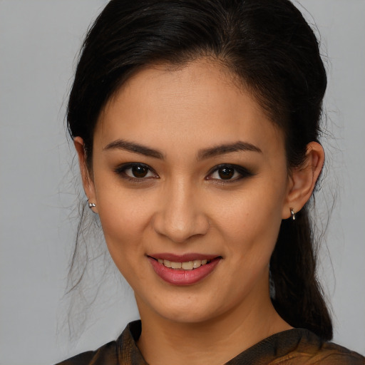Joyful white young-adult female with medium  brown hair and brown eyes