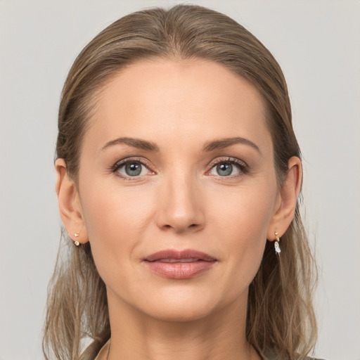 Joyful white young-adult female with long  brown hair and grey eyes