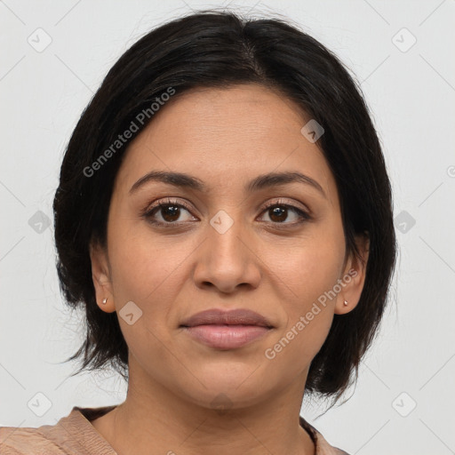 Joyful latino young-adult female with medium  brown hair and brown eyes