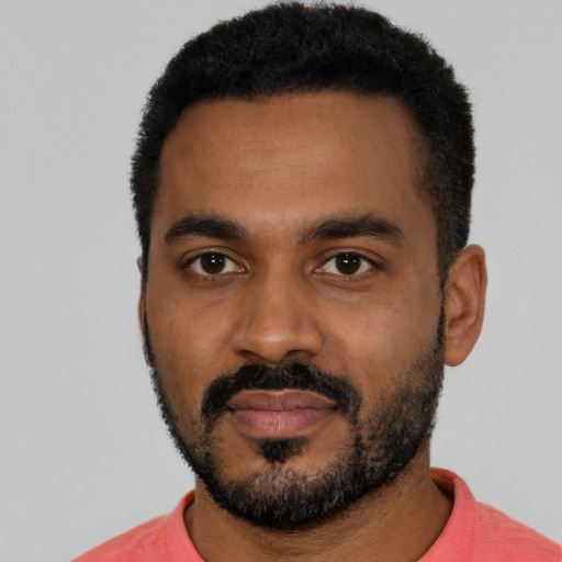 Neutral black young-adult male with short  black hair and brown eyes