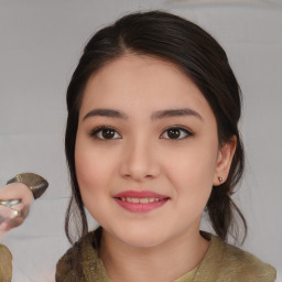 Joyful asian young-adult female with medium  brown hair and brown eyes