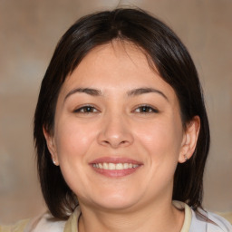 Joyful white young-adult female with medium  brown hair and brown eyes