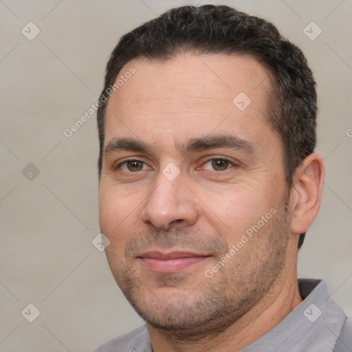 Joyful white adult male with short  brown hair and brown eyes