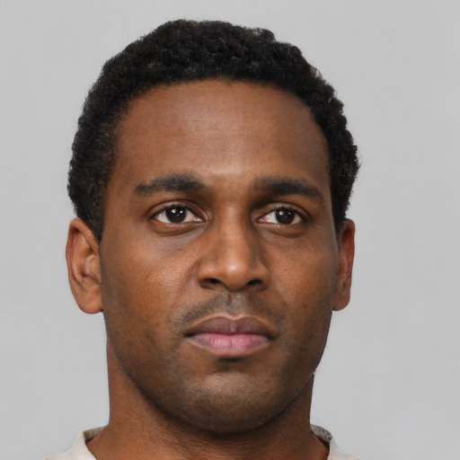 Neutral black young-adult male with short  black hair and brown eyes