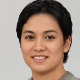 Joyful asian young-adult female with short  black hair and brown eyes