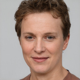 Joyful white adult female with short  brown hair and brown eyes