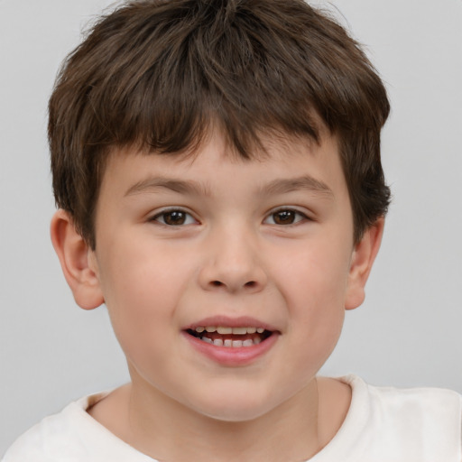 Joyful white child male with short  brown hair and brown eyes