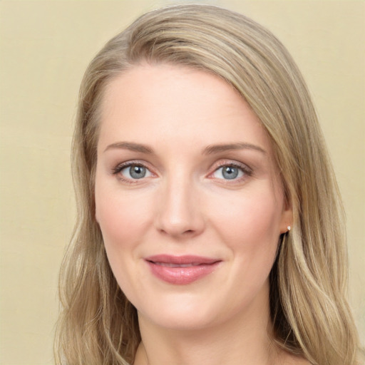 Joyful white young-adult female with long  brown hair and green eyes