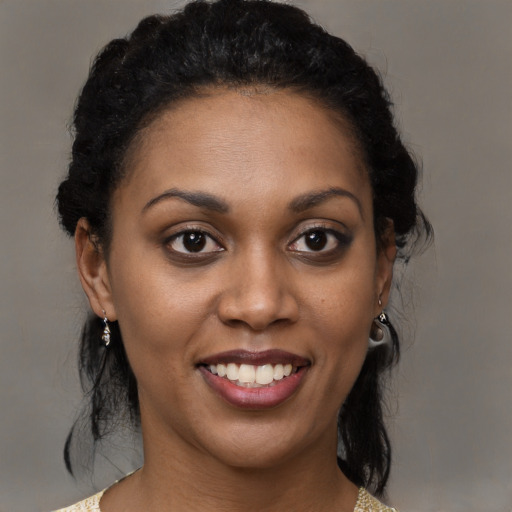 Joyful black young-adult female with medium  brown hair and brown eyes
