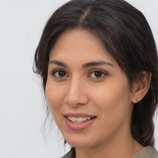 Joyful asian young-adult female with medium  brown hair and brown eyes