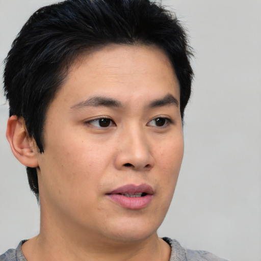 Neutral asian young-adult male with short  black hair and brown eyes