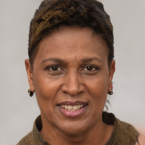 Joyful latino adult female with short  brown hair and brown eyes