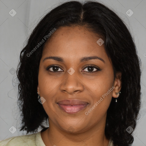 Joyful black young-adult female with long  brown hair and brown eyes