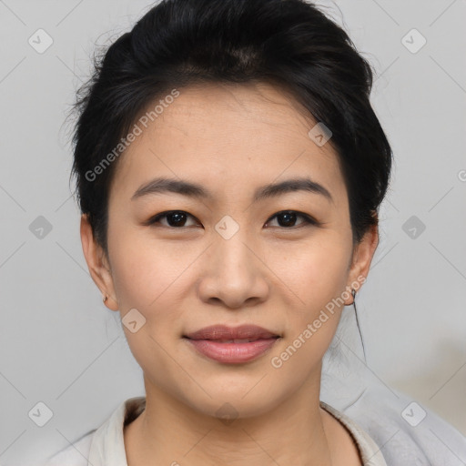 Joyful asian young-adult female with medium  black hair and brown eyes