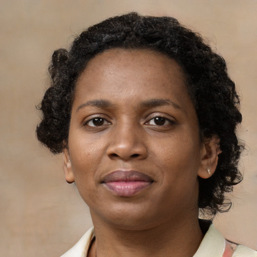Neutral black young-adult female with short  brown hair and brown eyes