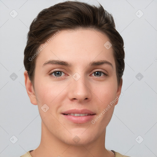 Joyful white young-adult female with short  brown hair and grey eyes