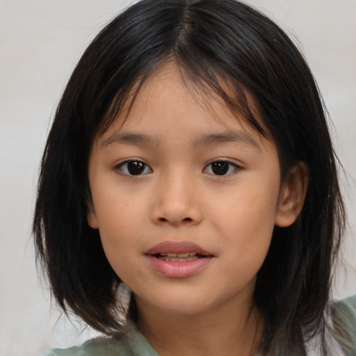 Joyful asian child female with medium  brown hair and brown eyes