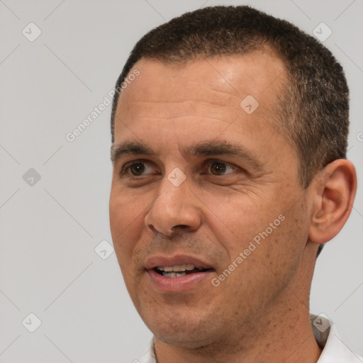 Joyful white adult male with short  brown hair and brown eyes