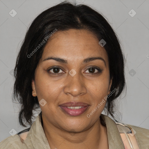 Joyful black adult female with medium  brown hair and brown eyes