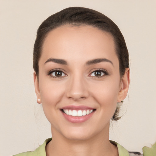 Joyful white young-adult female with medium  brown hair and brown eyes