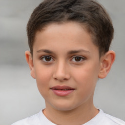 Joyful white child male with short  brown hair and brown eyes