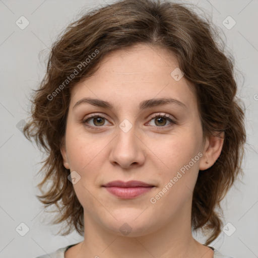 Joyful white young-adult female with medium  brown hair and green eyes