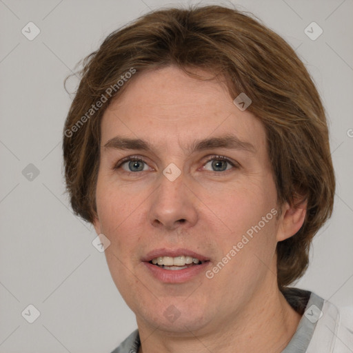 Joyful white adult female with medium  brown hair and green eyes