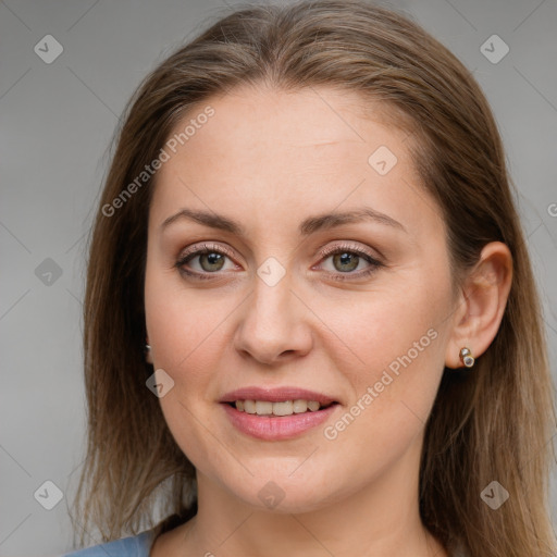 Joyful white young-adult female with long  brown hair and blue eyes