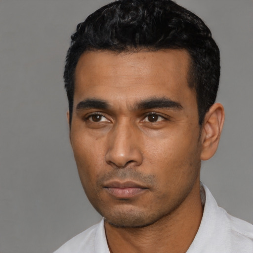 Neutral latino young-adult male with short  black hair and brown eyes