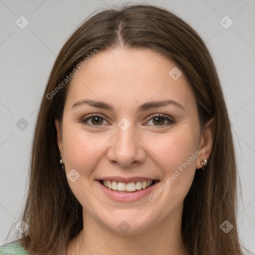 Joyful white young-adult female with long  brown hair and grey eyes