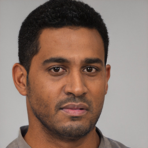 Neutral black young-adult male with short  black hair and brown eyes
