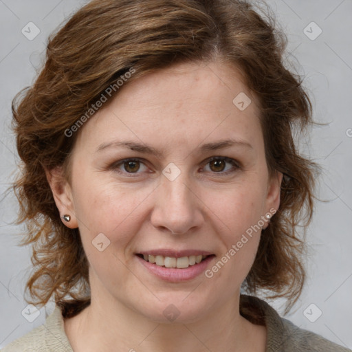 Joyful white adult female with medium  brown hair and blue eyes