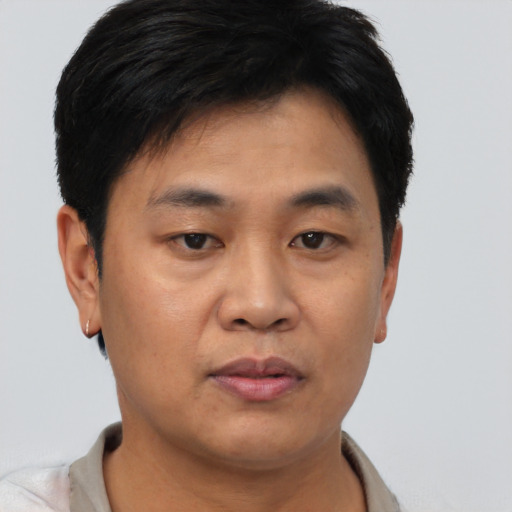 Neutral asian young-adult male with short  brown hair and brown eyes