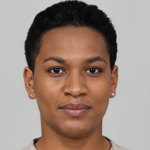 Joyful black young-adult female with short  black hair and brown eyes