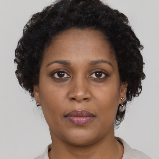 Neutral black young-adult female with short  black hair and brown eyes