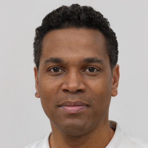 Neutral black young-adult male with short  black hair and brown eyes