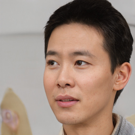 Neutral asian young-adult male with short  black hair and brown eyes