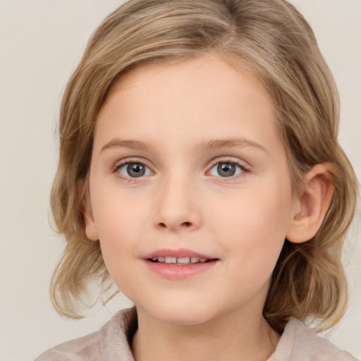 Joyful white child female with medium  brown hair and blue eyes