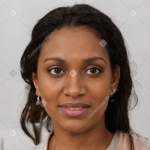 Joyful black young-adult female with long  brown hair and brown eyes