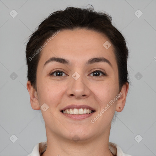 Joyful white young-adult female with short  brown hair and brown eyes