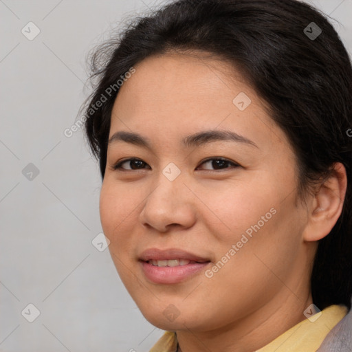 Joyful asian young-adult female with medium  brown hair and brown eyes