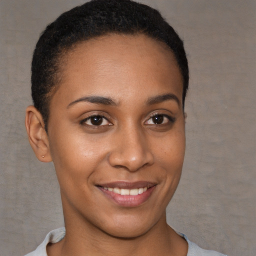 Joyful white young-adult female with short  brown hair and brown eyes