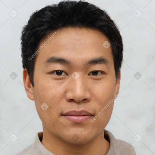 Joyful asian young-adult male with short  black hair and brown eyes