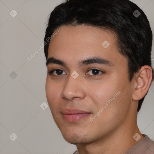 Joyful white young-adult male with short  black hair and brown eyes