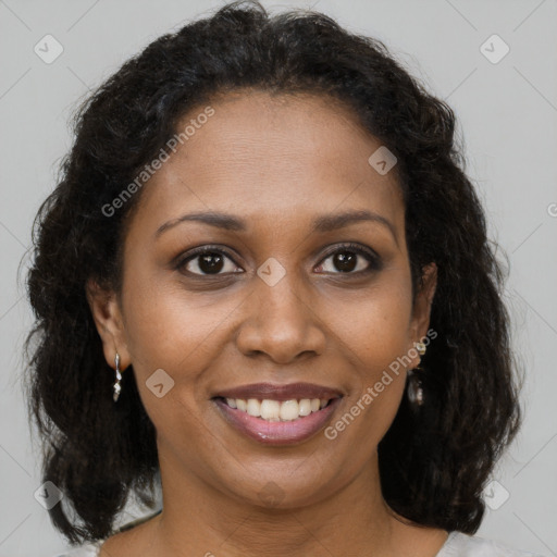 Joyful black young-adult female with medium  brown hair and brown eyes